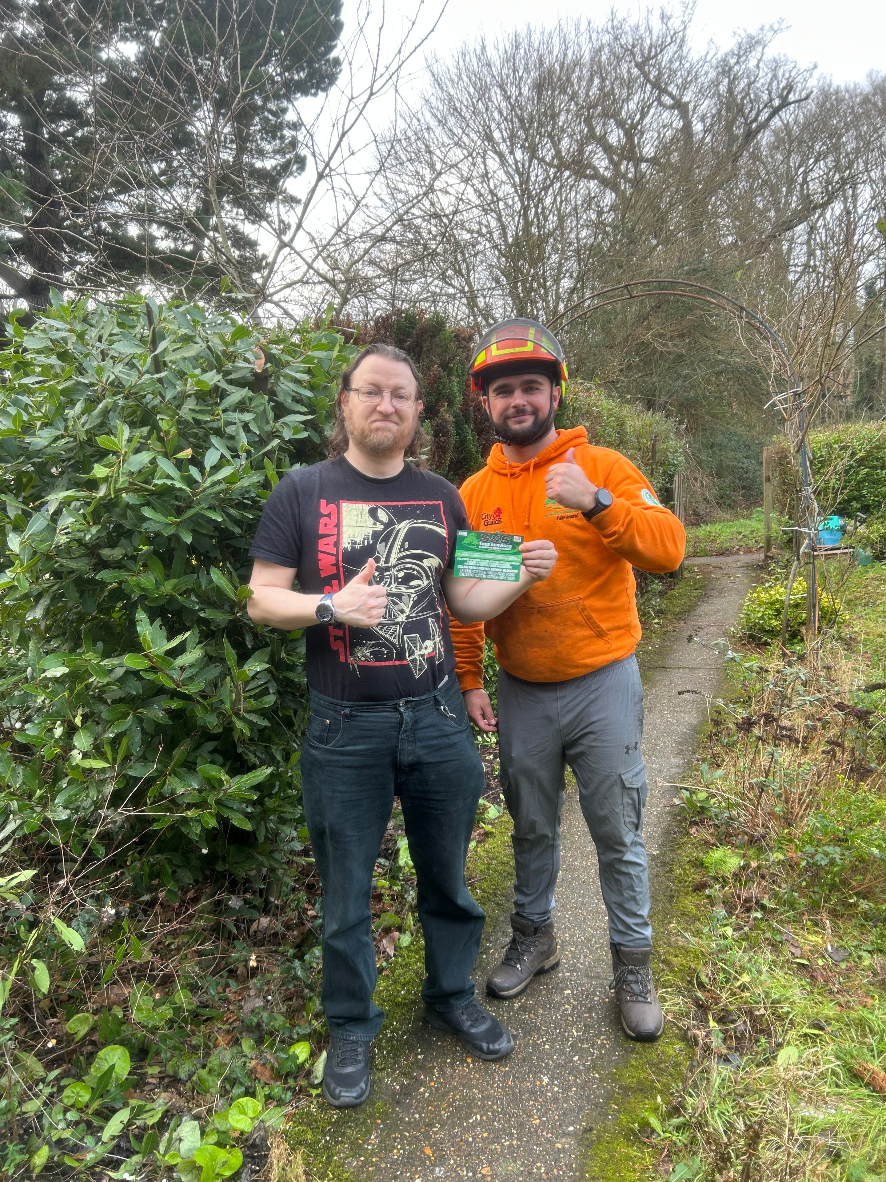 Emmanuel from S&S Tree Services with a satisfied customer on site